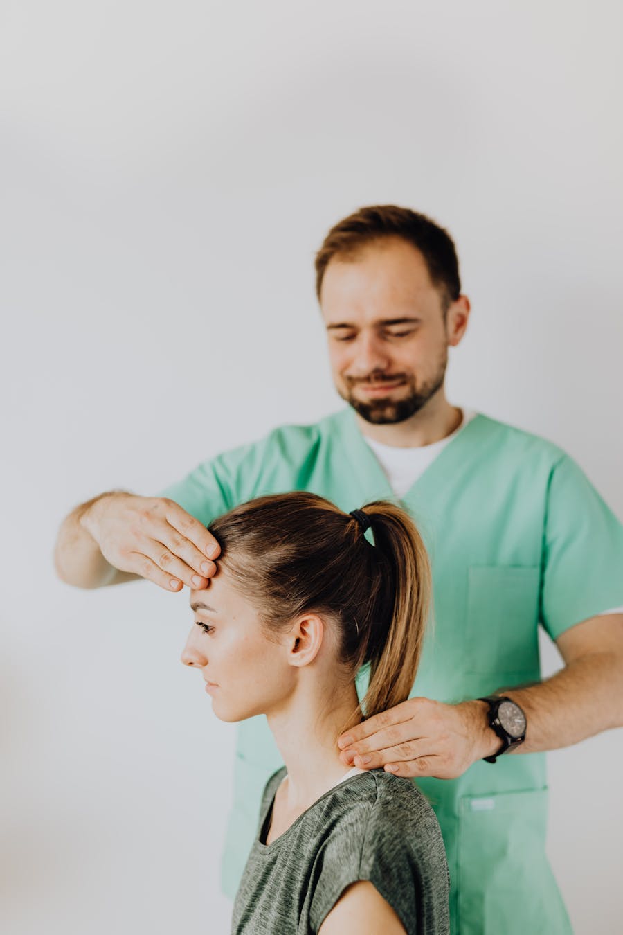 Chiropractor performing a neck adjustment